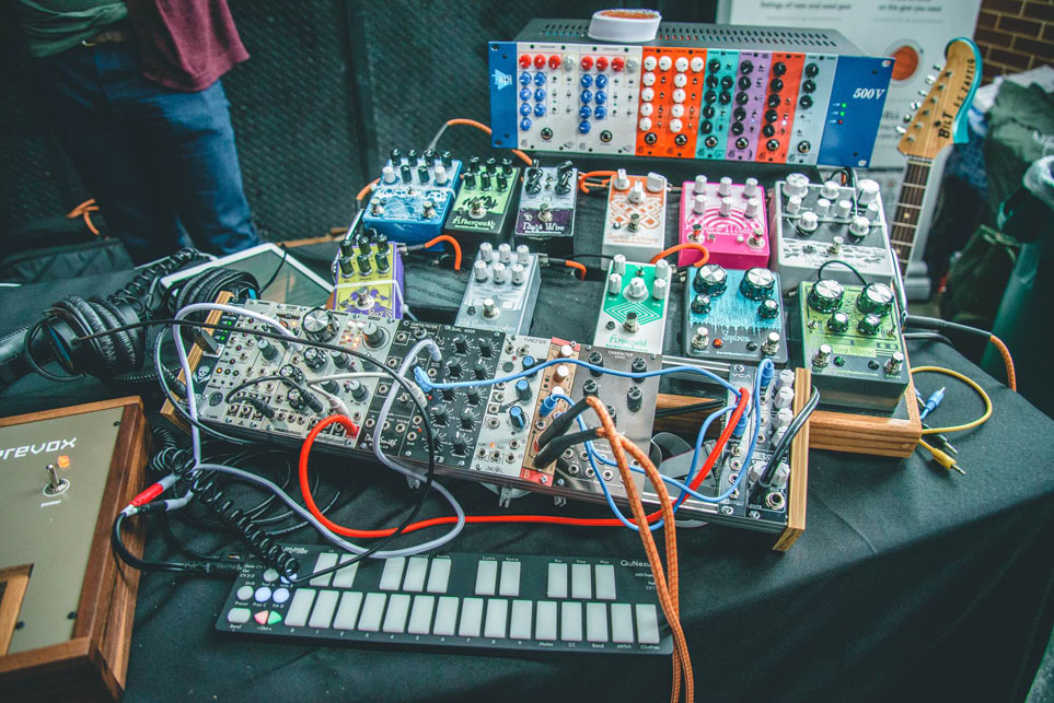 A modular rig at running through EarthQuaker Devices pedals and a JHS 500 series rack