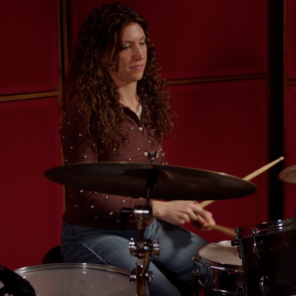 Jessica sitting at the drum kit