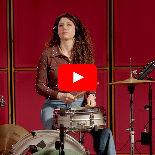 Jessica sitting at the drum kit