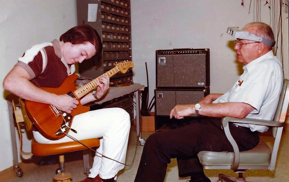 Tim Bailey playing F-100 with Leo Fender, Leo’s G&L workshop.