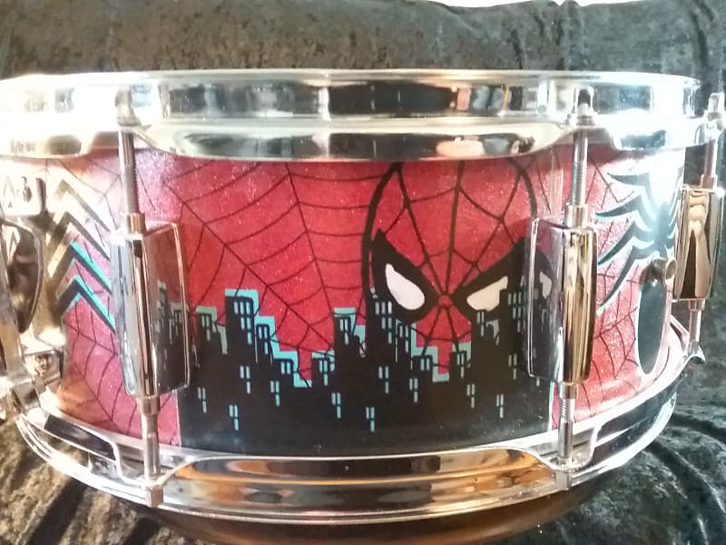 Mapex Assaulted Battery custom Spider-man themed graphics over a red sparkle finish. custom Spider-man multi layer