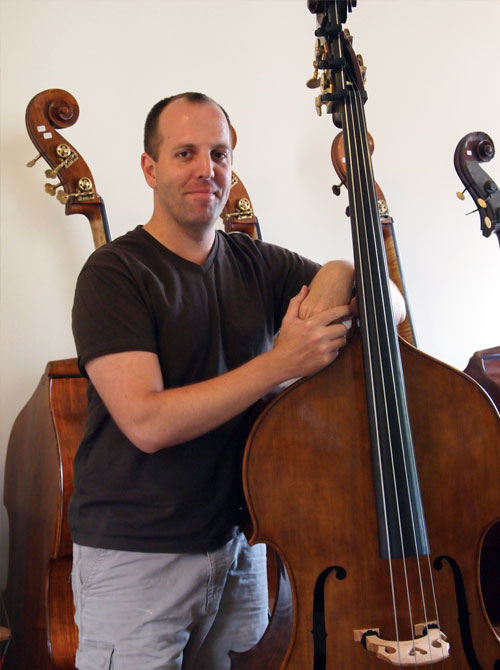 Bass maker Nick Lloyd with his 7/8 Standard Model double bass.