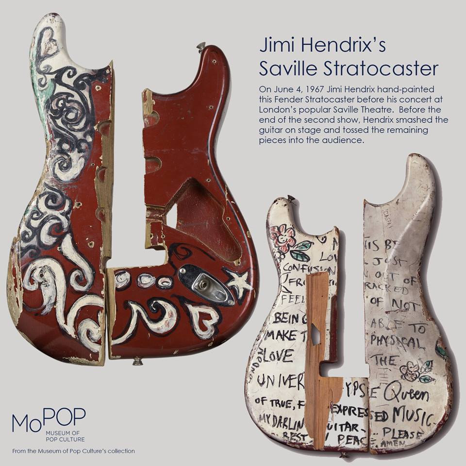 An ad for the Saville Strat exhibit at the Museum of Pop Culture, showing off the splintered remains of the guitar.