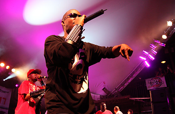 juicy j and dj paul performing on stage