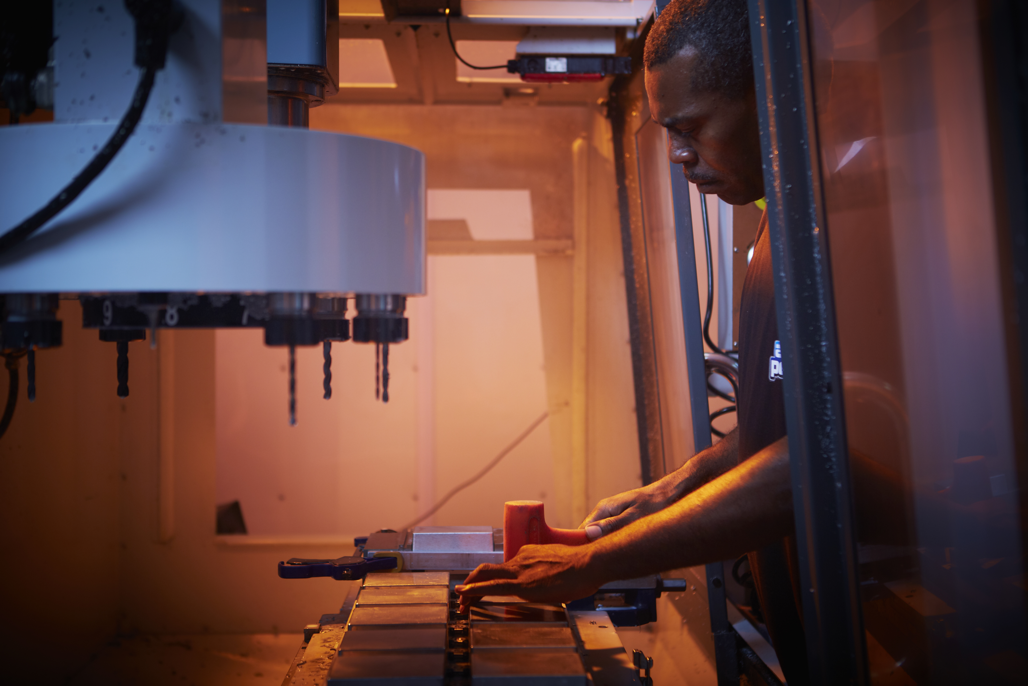 An employee preps the enclosures for drilling.