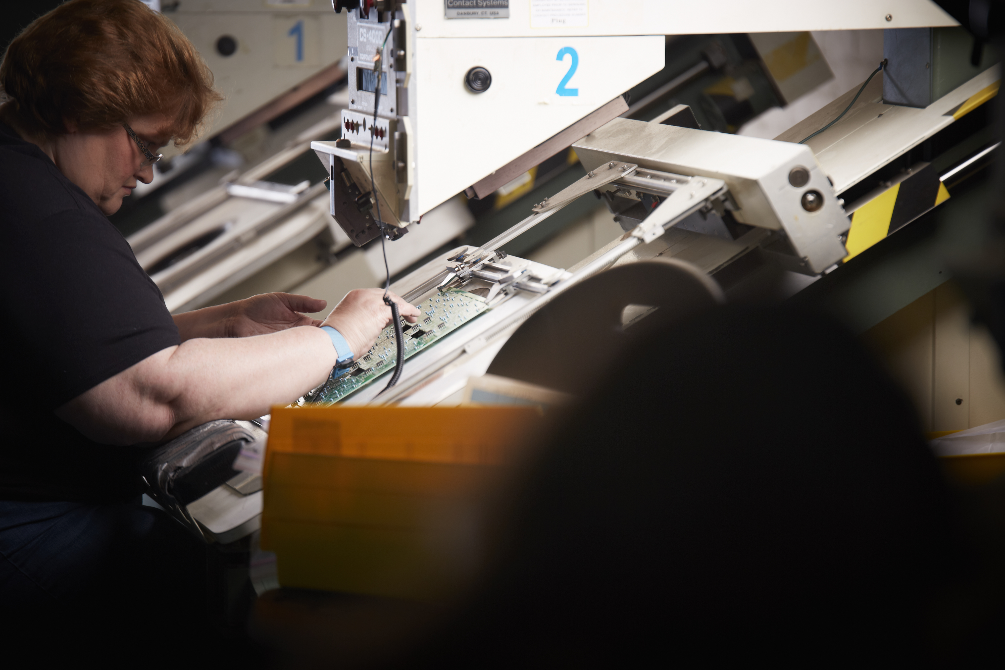 An All-Pedal employee inspects a design in process.