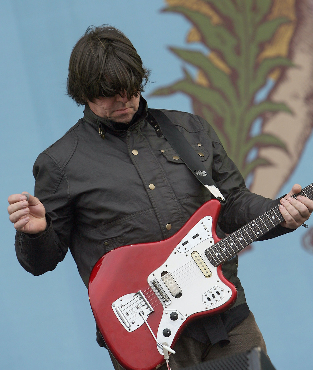 will sergeant on stage playing a red fender jaguar