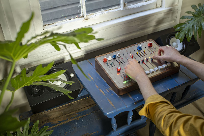 overhead shot of the balsam synth with hands playing it