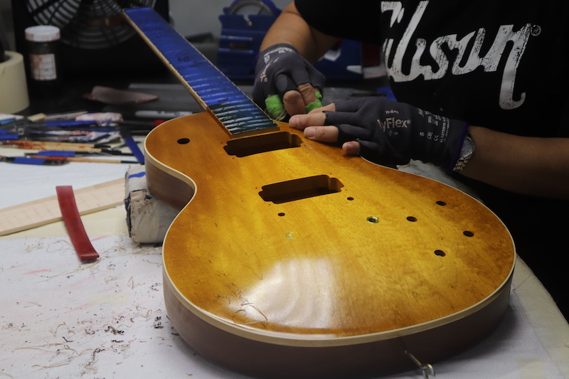 guitar being finished and sanded