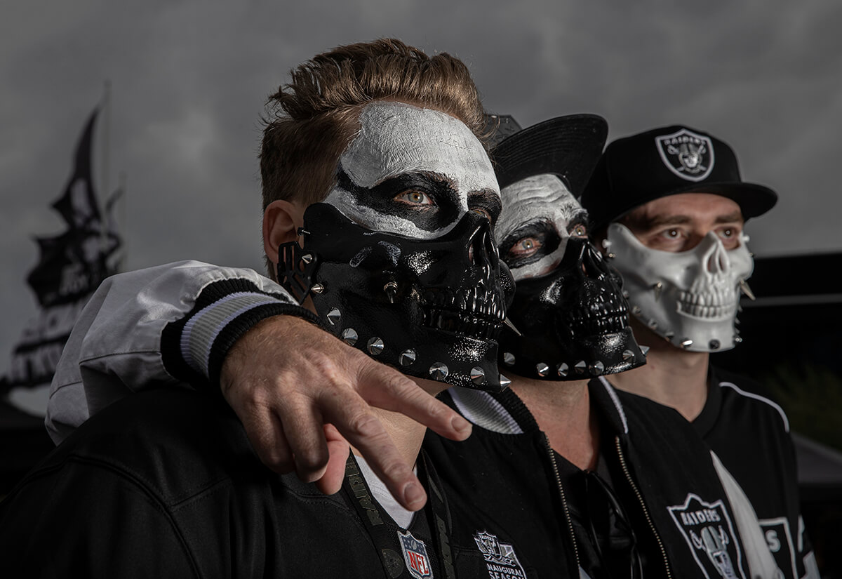 A fan of the Oakland Raiders dresses in full face paint with Raider