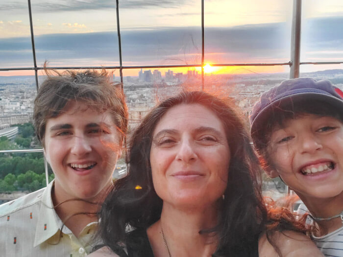 Sarah and her family enjoying a sunset from the Eiffel Tower in Paris, France.
