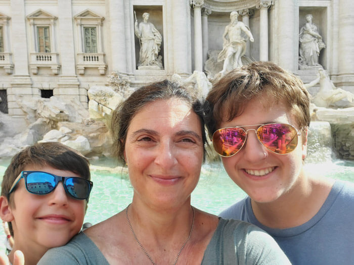 Sarah and her family at the Trevi Fountain in Rome, Italy.
