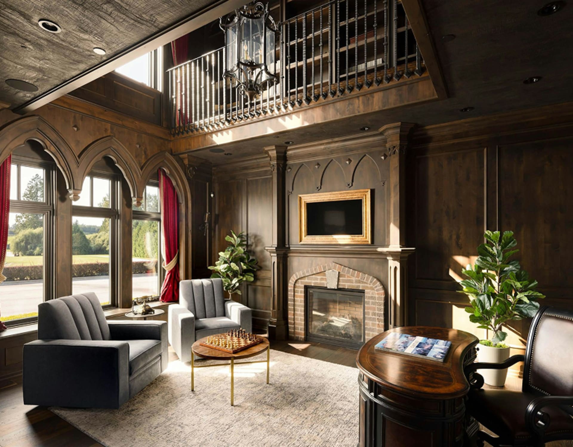 A cozy and elegant living room with a fireplace, wooden beams, and a balcony.