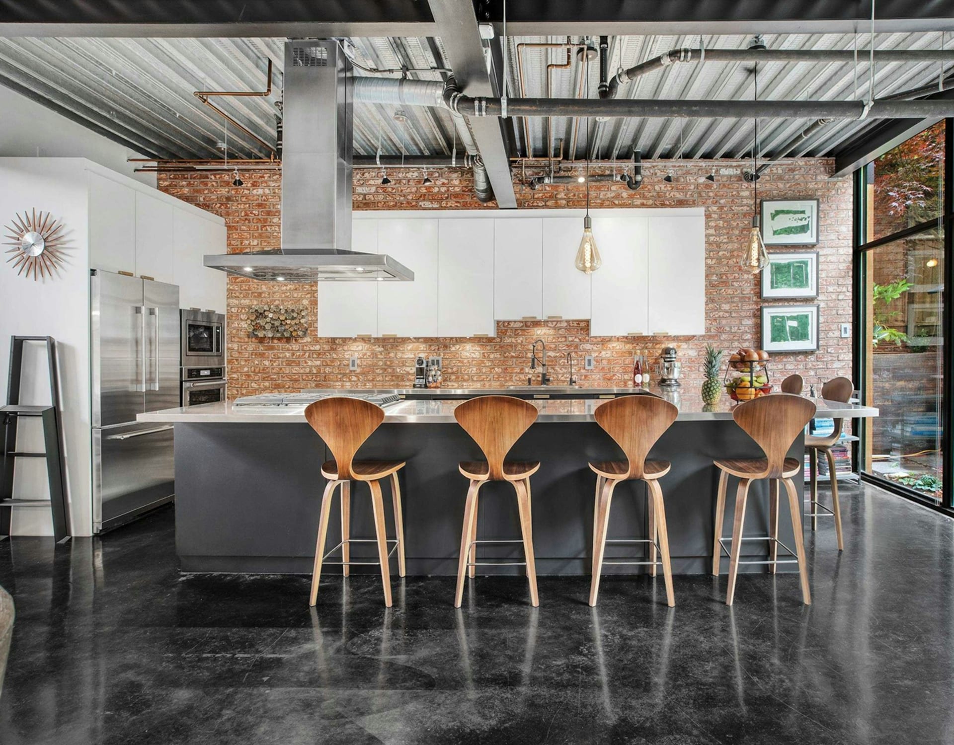 A dark grey island in the kitchen.