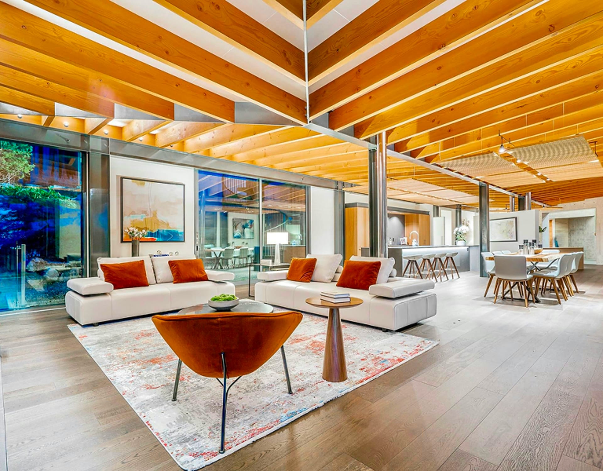 A snapshot of the living room, kitchen and dining area.