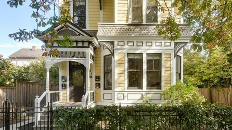 Move the whole family into this converted Victorian fourplex on the Island. image