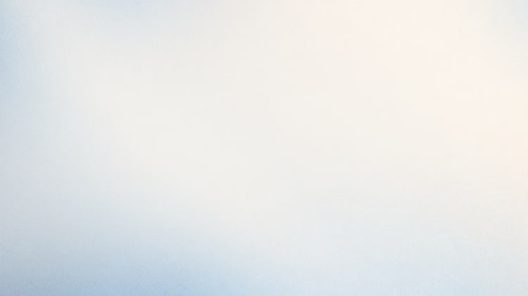A soft gradient of light blue and white blends seamlessly from the foreground into the background.