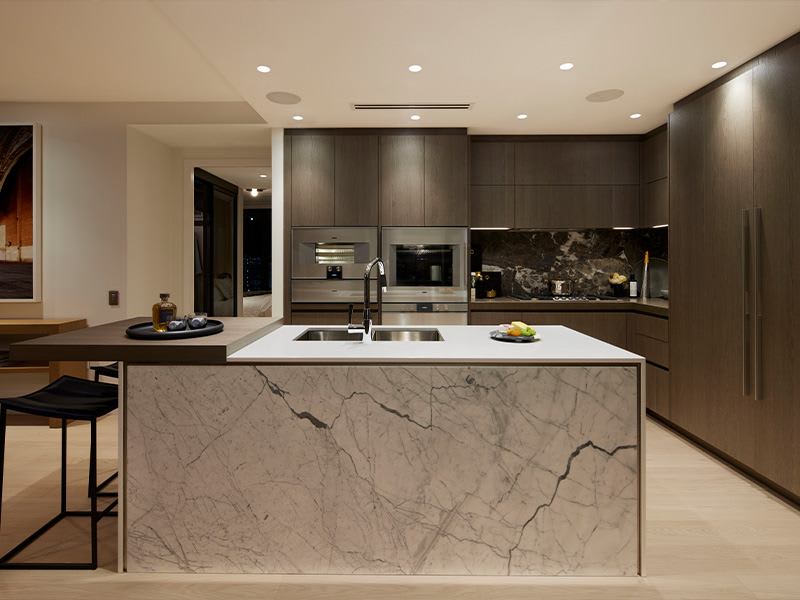 Custom Poliform kitchens outfitted with Italian marble and Gaggenau appliances.