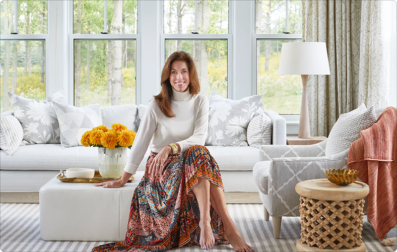 Sarah Richarson seated inside a room she did the interior design for. 