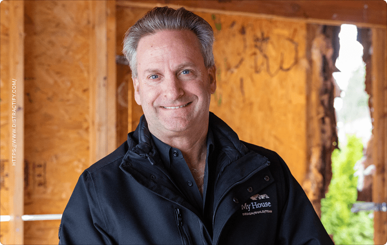 Graham Huget standing inside a home undergoing renovations.