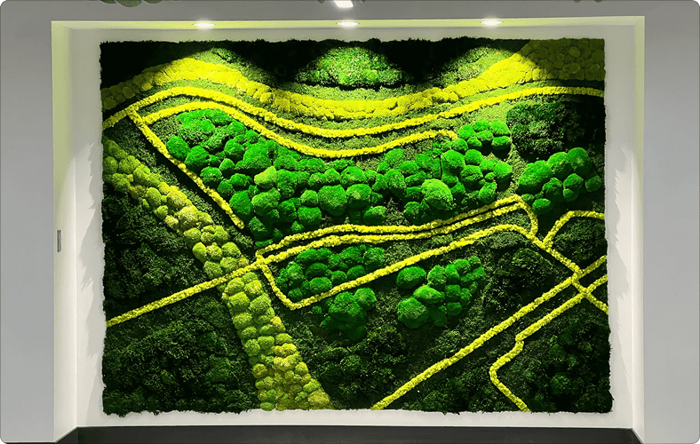 Artwork by Emma Terrell that uses various shades of green plants to create a landscape.