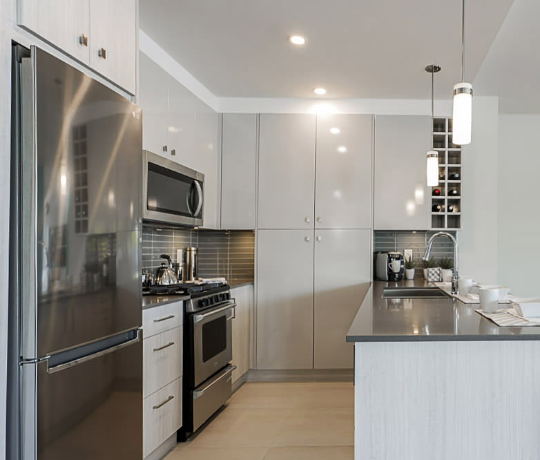 A stylish kitchen with modern amenities. Photo by Hamilton Village. 