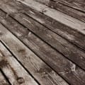 Wood decking showing cracks and age