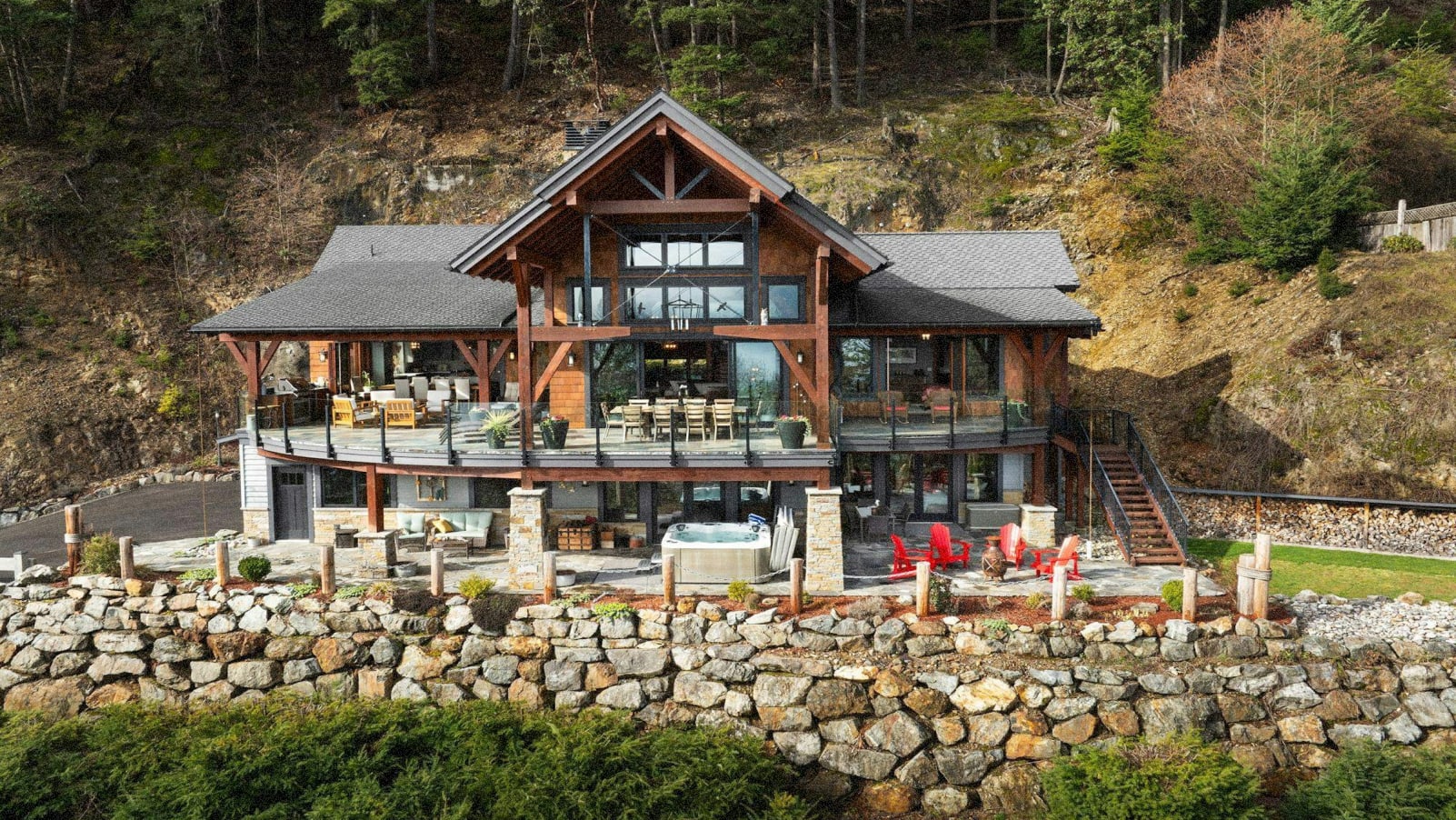 Detached large home on Bowen Island on a large, grassy, hilly lot.