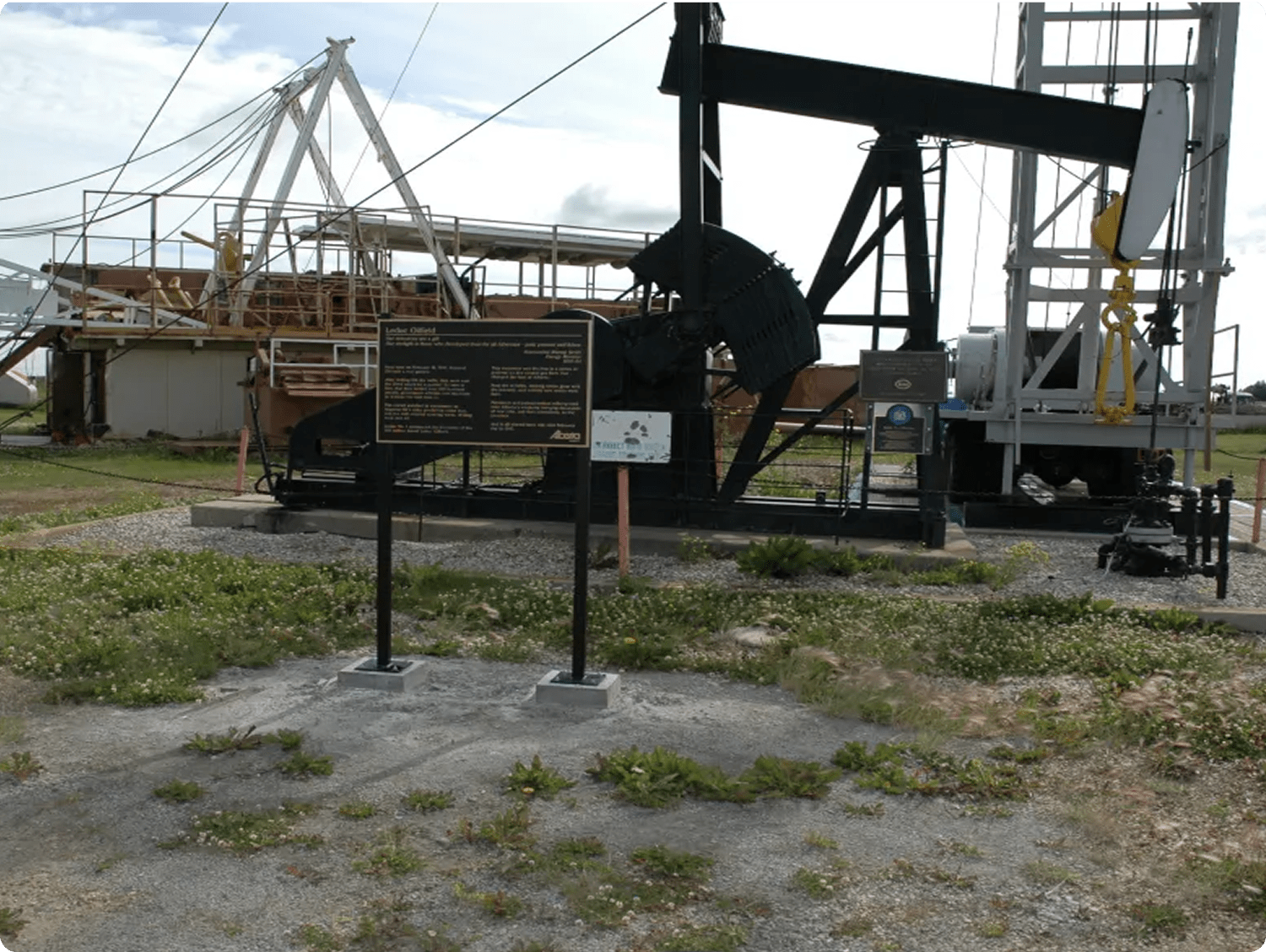 A decommissioned pump-jack is installed over top of the Leduc No. 1 Provincial Historic Resource.