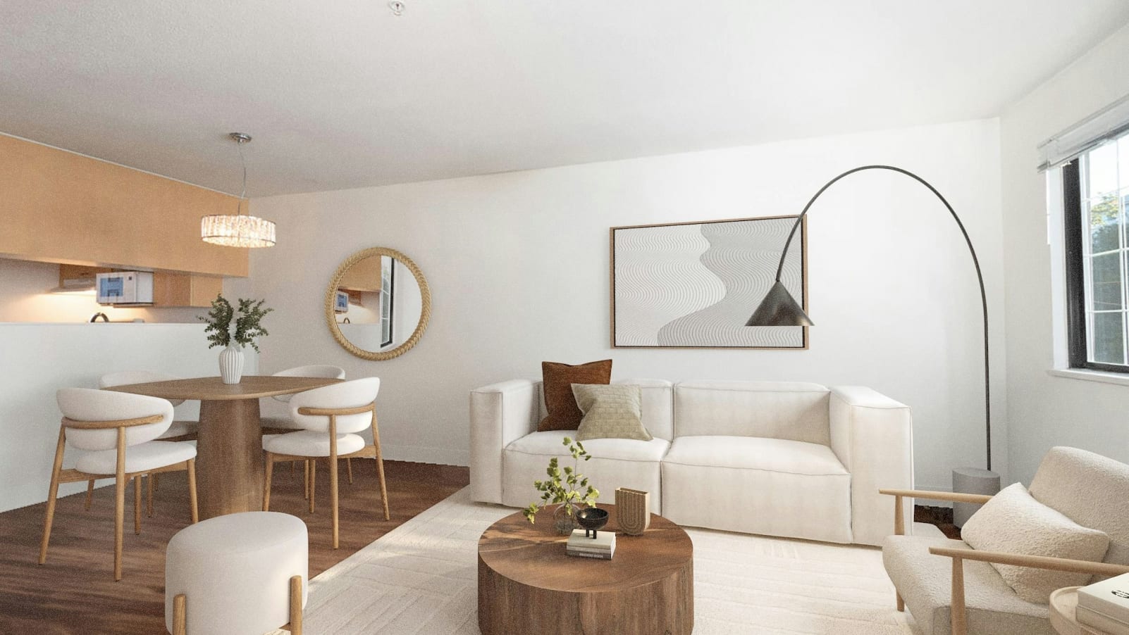 A cozy and modern living room with a dining area, featuring neutral-toned furniture, a wooden table, and decorative elements such as mirrors and artwork on the walls.