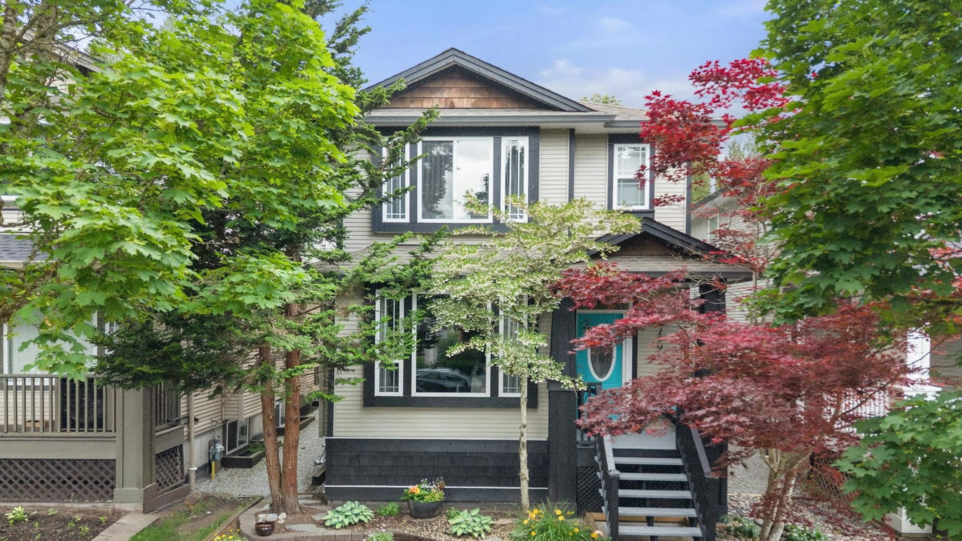 A home with a teal door in Maple Ridge.