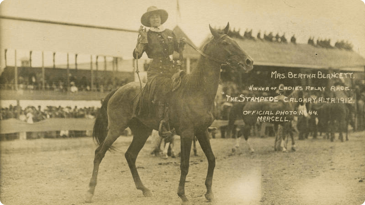 A sepia photograph of winner the Ladies’ Race, Bertha Blancett, on her horse at the Calgary Stampede.