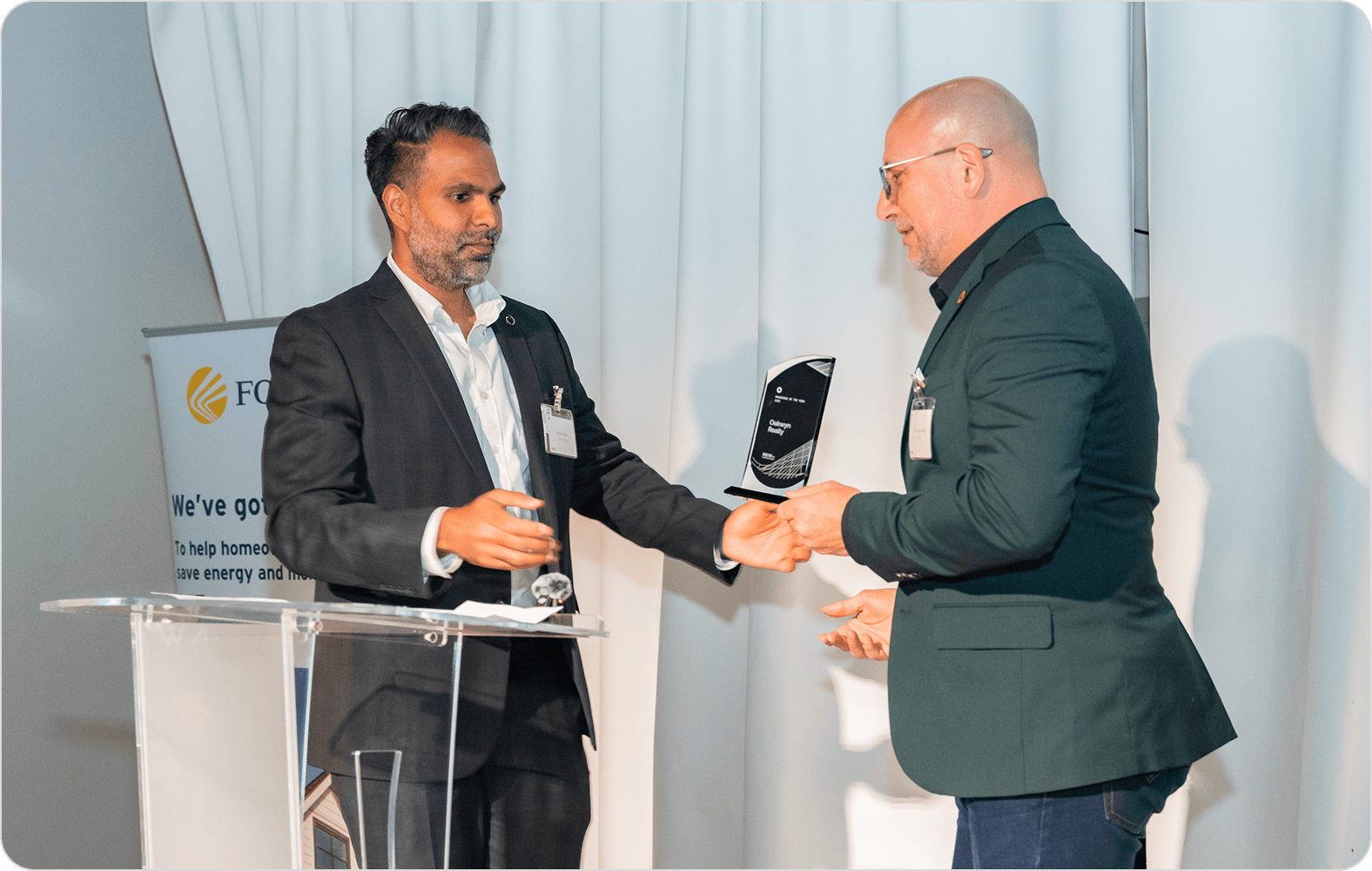 Shawn Kambo of Oakwyn Realty receiving the 2025 Brokerage of the Year Award.