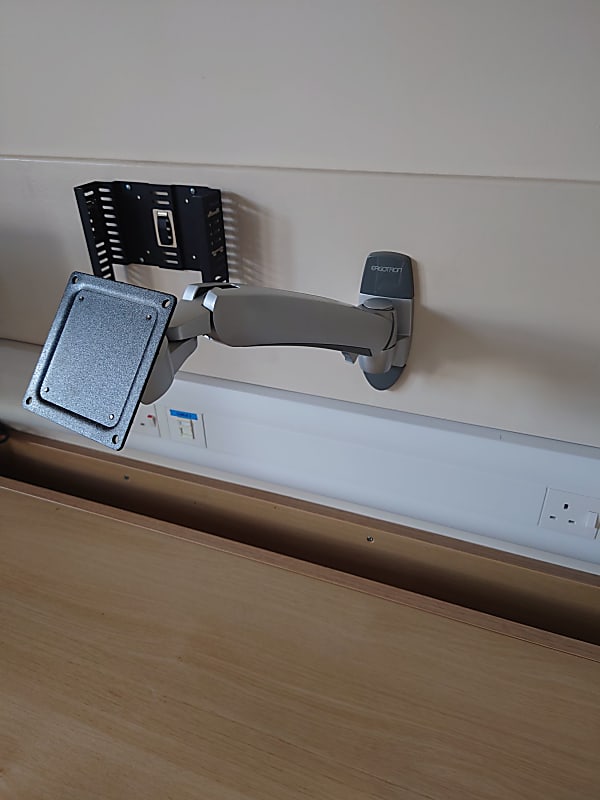 Wall mounted monitor arms