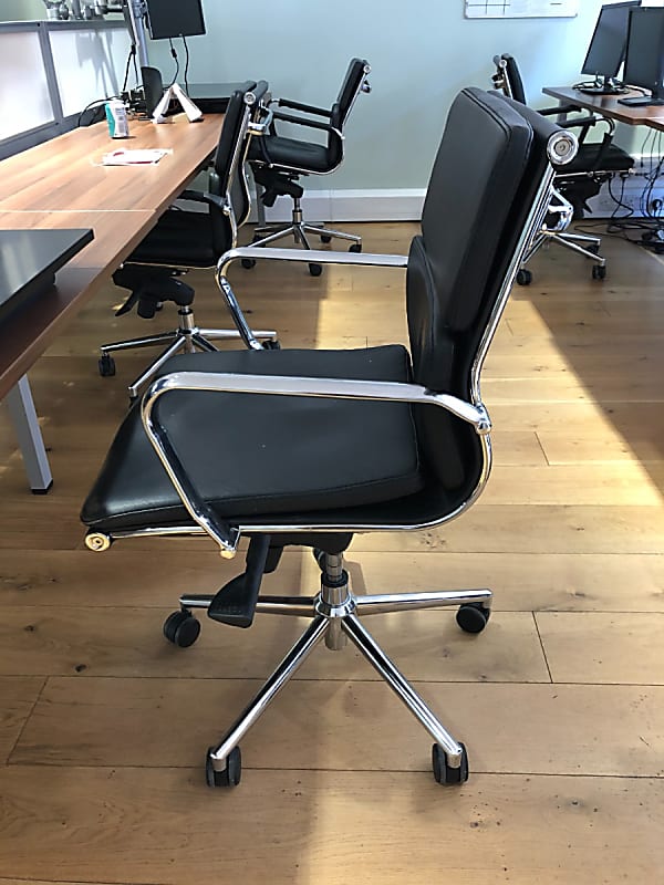 Black leather and chrome frame office operator chair