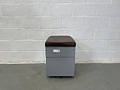 Grey two drawer metal pedestal with brown faux leather seat