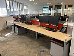 Bank of 6 Steelcase Bench Desks with red dividers