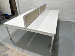 Compact bank of 4 white bench Desks with dividers