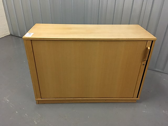 Low wooden tambour cabinet with suspension rack and shelf