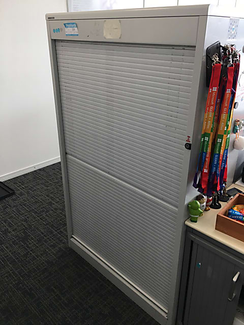 Tambour cabinet with roller shutter