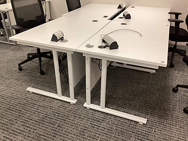 white desk with white metal base