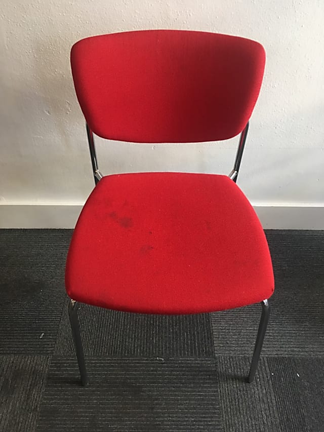 silver-framed red fabric padded chair