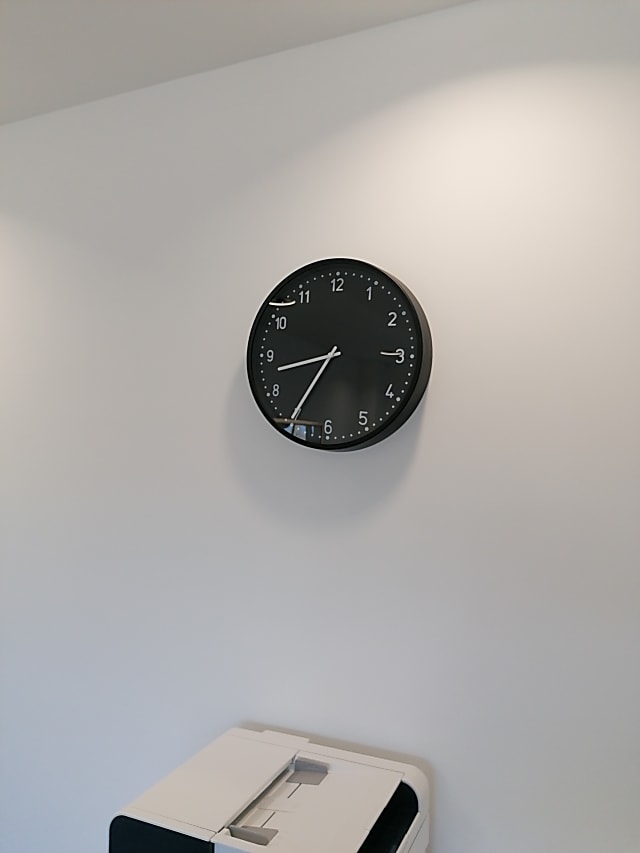 round black analog wall clock