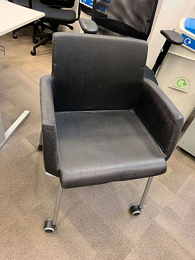 Black leather armchair on wheels