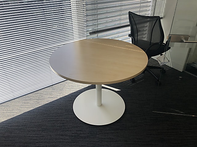 round brown wooden pedestal table