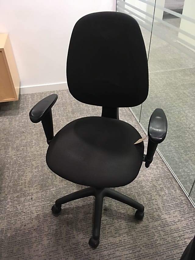 Black rolling operator chair