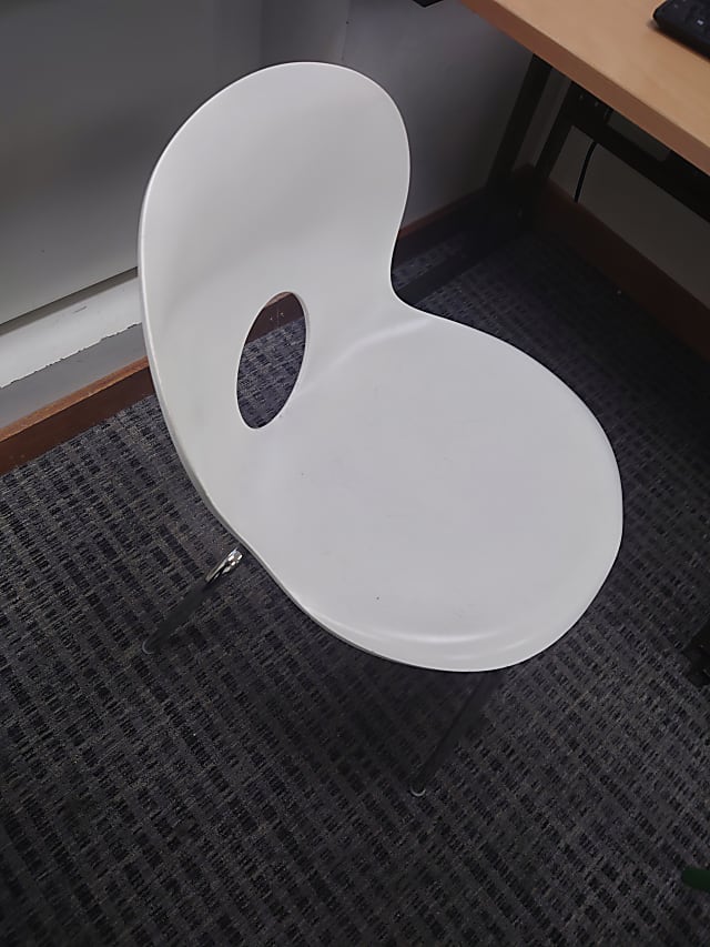 White chair large hole in back