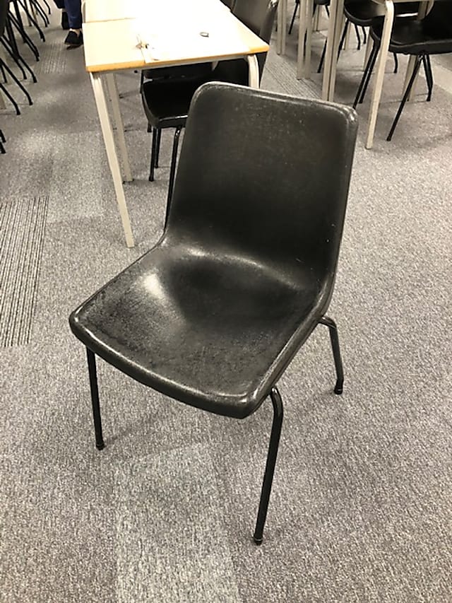 Black plastic waiting room chair