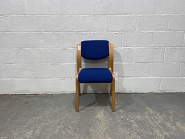 brown wooden framed blue padded chair