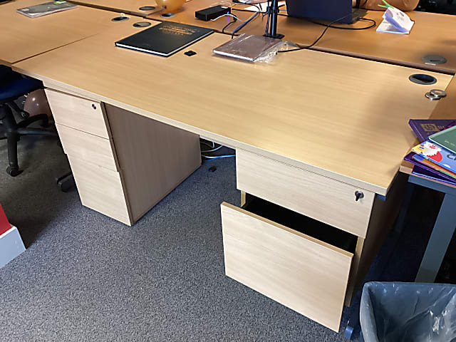 brown wooden knee-hole desk with pedestal leg